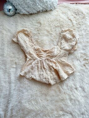 Urban Outfitters cream textured peplum top with puff sleeves